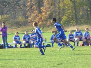 Alex runs down a ball during a game with his Honeoye teammates in October.