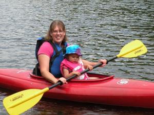 Mommy and Graciela kayaking Cascade Lake in the Adirondack Mountains in August. 